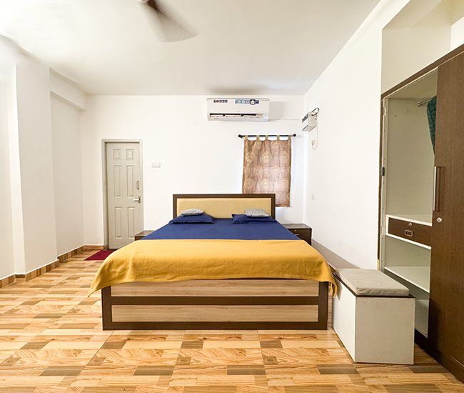 Spacious luxury bedroom in Emirates Beach Villa with cozy comfort near Kovalam beach, ECR Chennai.