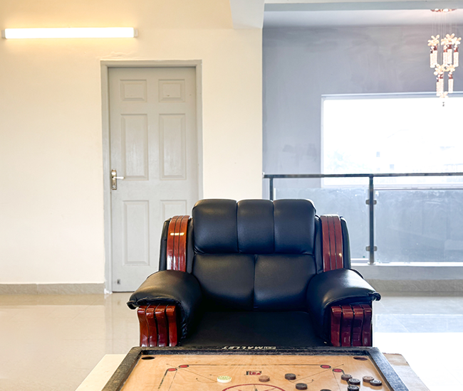 Stylish sofa lounge area in Emirates luxury villa interior near the beach on ECR Chennai.