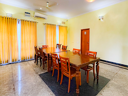 Spacious dining room inside Amrith Palace in ECR Chennai designed for comfortable group stays