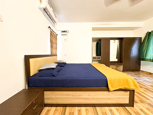 Luxury bedroom at Emirates Beach House in ECR ensures a peaceful private stay with modern comfort