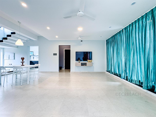 Spacious living area inside Zephyr Villa at ECR Chennai provides calm comfort for private stays