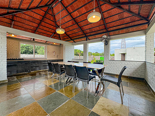 Outdoor dining space at Zephyr Villa in ECR Chennai offers open air comfort for groups and families