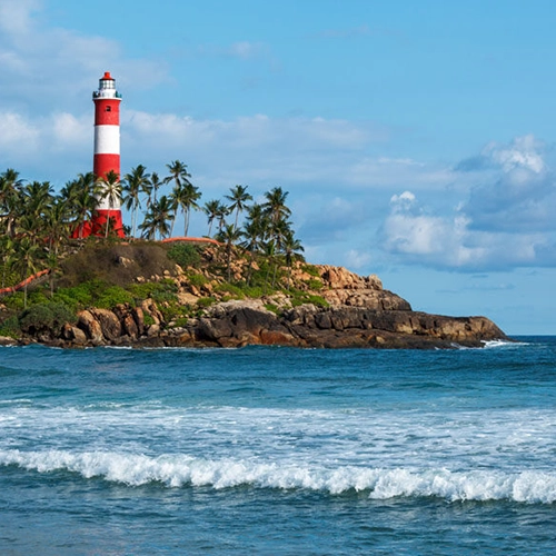 Kovalam Beach near Amrith Palace ECR known for water sports and seaside cafés.